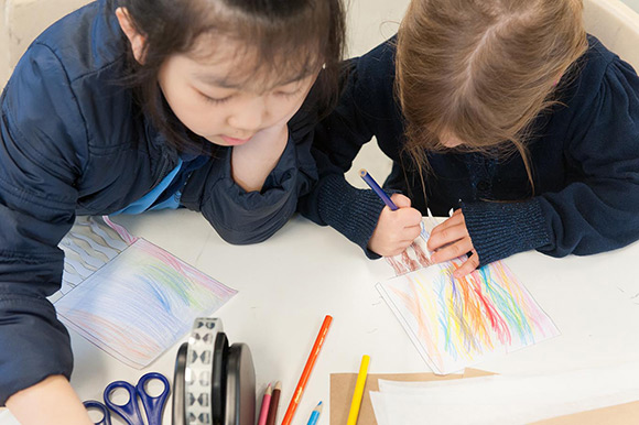 Children participate in hands-on activities developed in collaboration with Cai Guo-Qiang as part of the 'Kids on Tour' program. Photograph: Queensland Art Gallery | Gallery of Modern Art